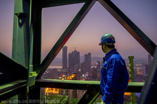 Hard-working hands behind high-rise skyscraper