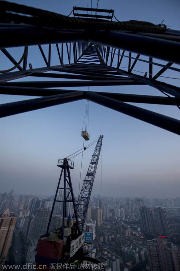 Hard-working hands behind high-rise skyscraper