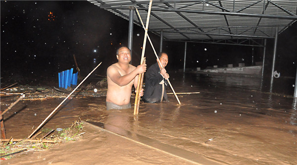 Rain-triggered flood hits SW China