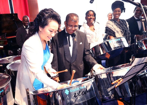 First lady turns on the charm, impresses hosts