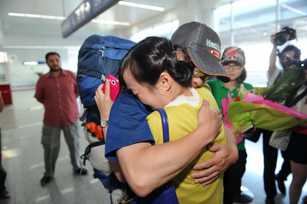 Surviving mountaineer returns to China