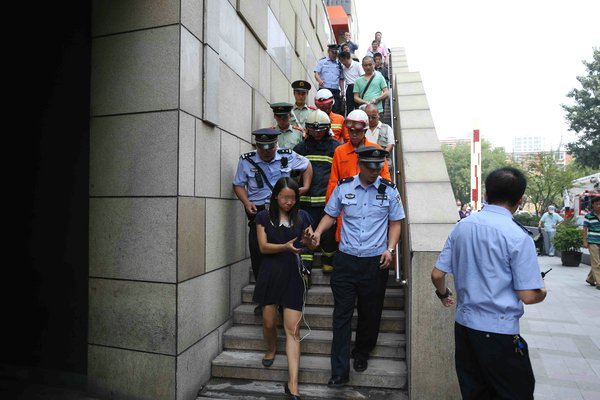 Woman pulled off the ledge in Beijing