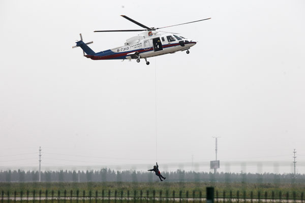 Helicopters practice acrobatic moves for expo