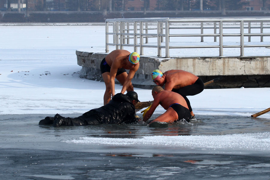 Man saved after falling through frozen lake