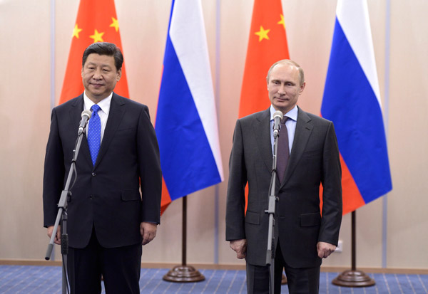 Xi, Putin vow stronger ties