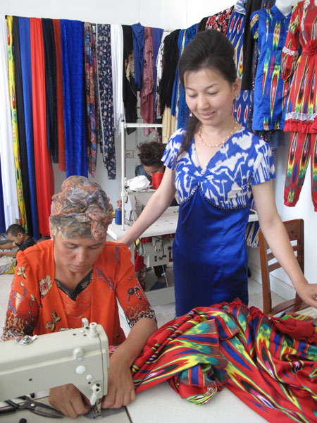 uygur tailor stitches future in her dressmaking studio