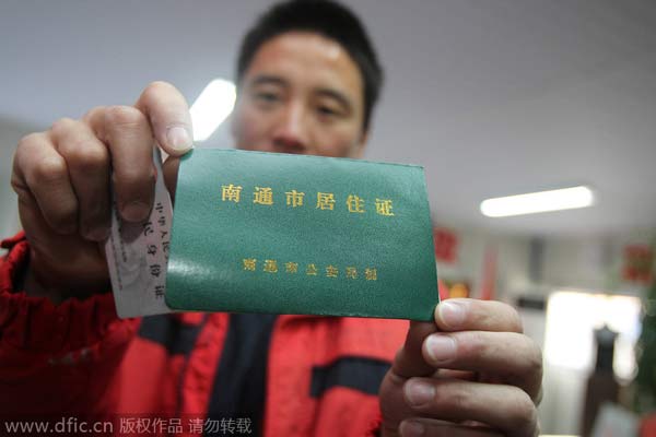 China to abolish controversial temporary residence permit