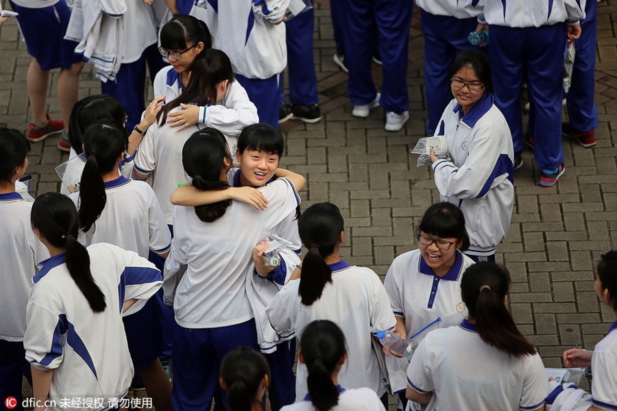 Hugs, anxious parents, high-tech security: China's college entrance exam starts