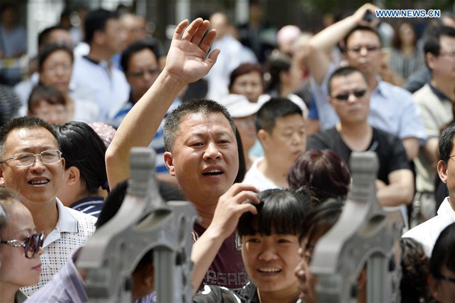 Hugs, anxious parents, high-tech security: China's college entrance exam starts