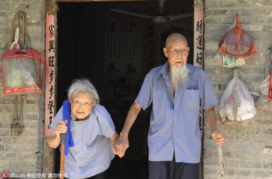 Centenarian couple embrace diamond wedding anniversary