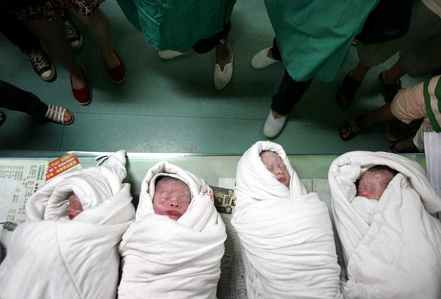 Four of a kind: Quadruplets get ready for school in Changsha
