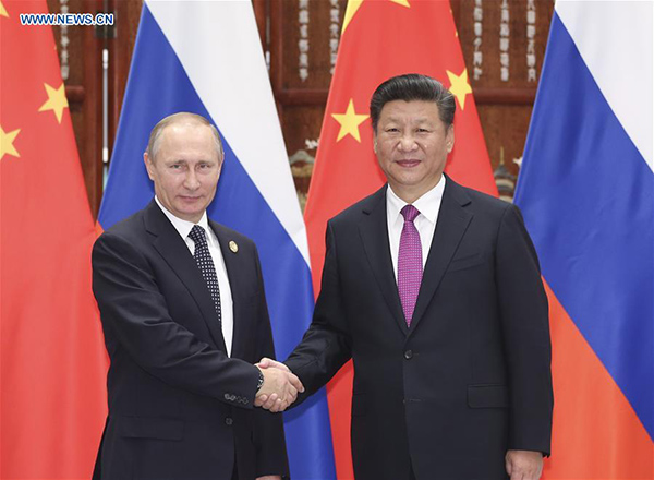 Xi meets Putin, calling for firm mutual support