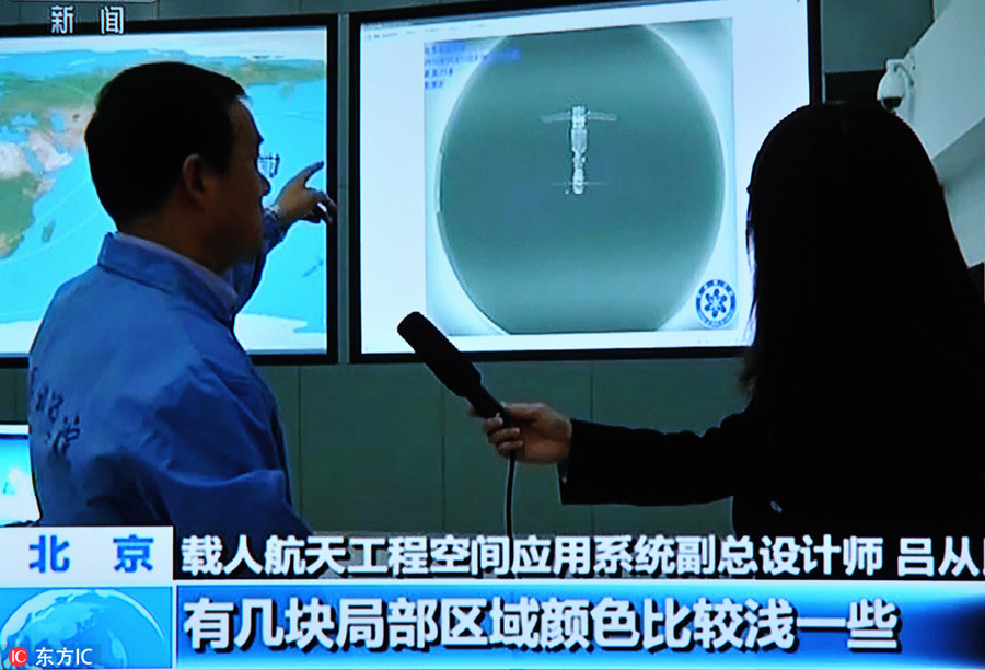 Accompanying satellite sends back images of Tiangong II, Shenzhou XI