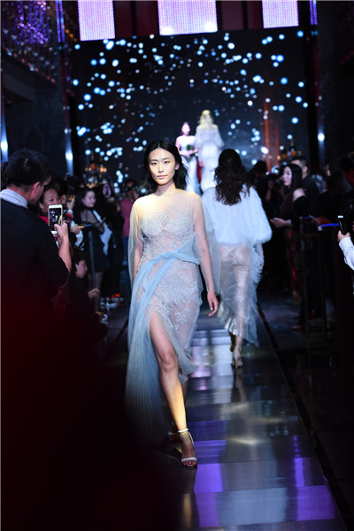 Models present creations at W Beijing's fashion wedding show