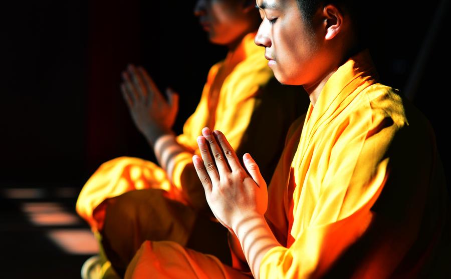 Monks practice martial art at Quanzhou Shaolin Temple