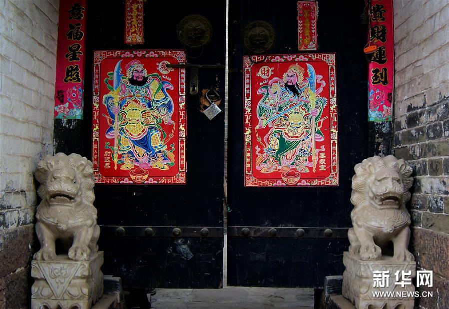 Pictures of door gods decorate homes after Little New Year