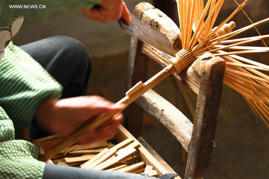 Traditional techniques of making Jialu oilpaper umbrellas in E China