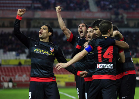 Atletico beat Sevilla to set up Cup final with Real