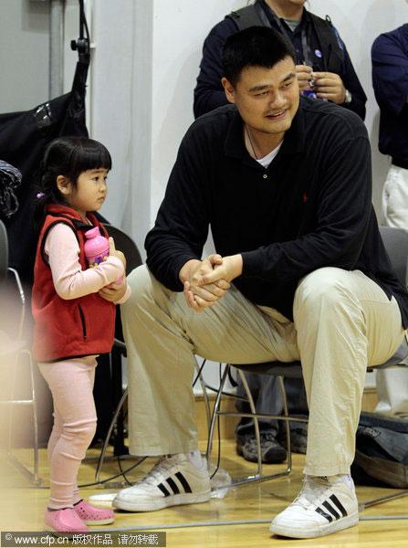 Yao with his daughter at the NBA Cares
