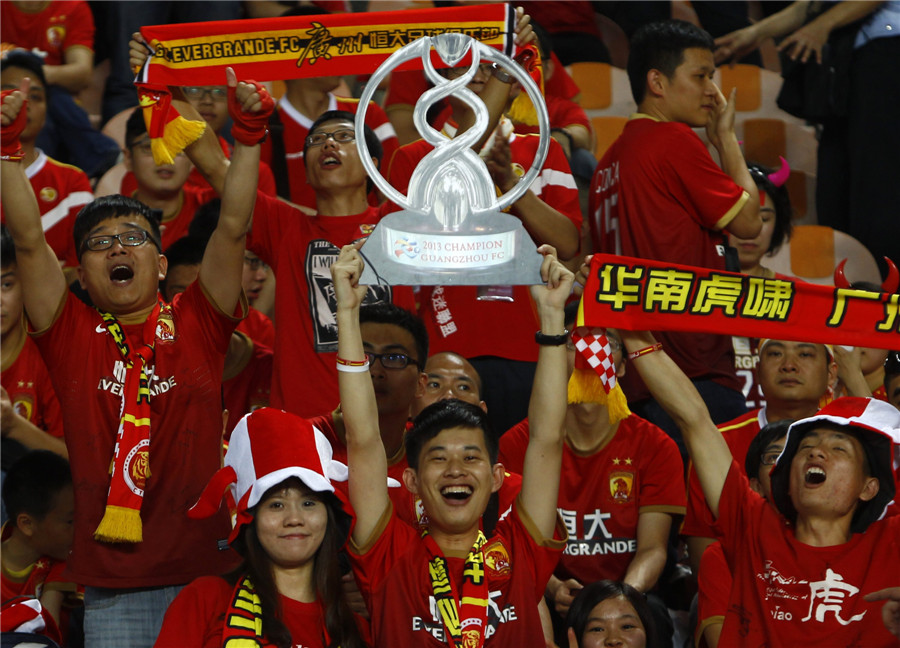 Football fans cheer for Guangzhou Evergrande