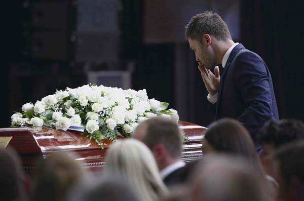 Australia bids farewell to Hughes in hometown funeral
