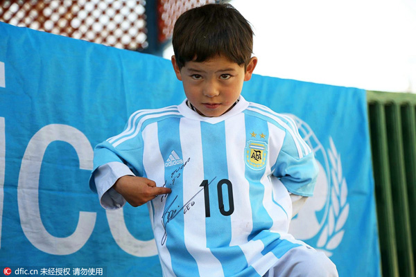 Afghan boy who wore plastic bag 'Messi' shirt gets signed jersey from soccer star