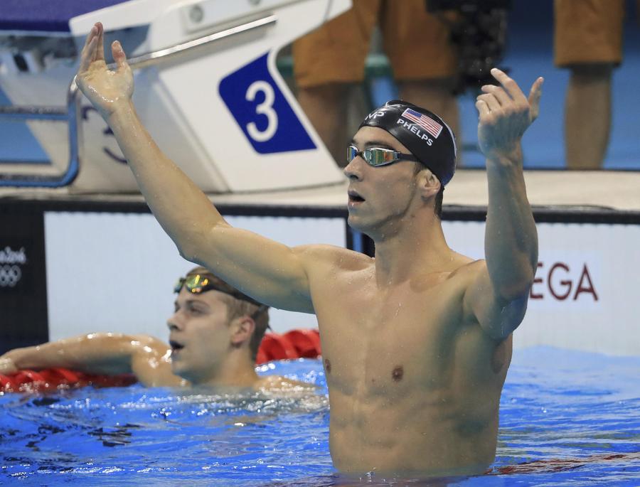 Phelps adds Olympic gold medal haul to historic 21