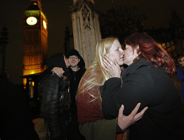 Cameron's party split as gay marriage vote passes