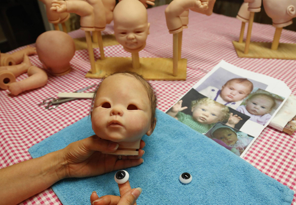 They are not real babies, but dolls
