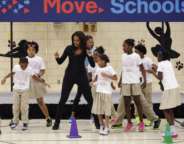 US First Lady joins O'Neal at back to school event