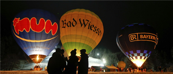 People light up hot air balloons in Germany