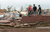 Death toll rises as storms tear through south US