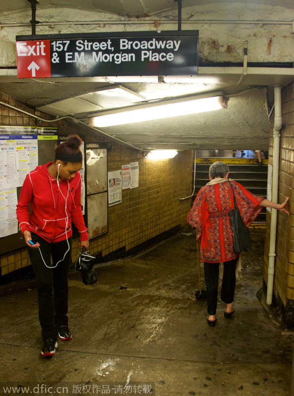 Heavy rain, floods swamp NYC metro stations