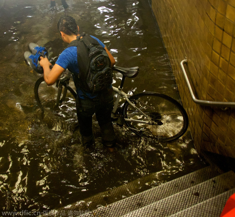 Heavy rain, floods swamp NYC metro stations