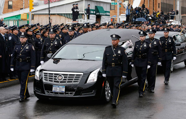 Thousands see off slain police officer