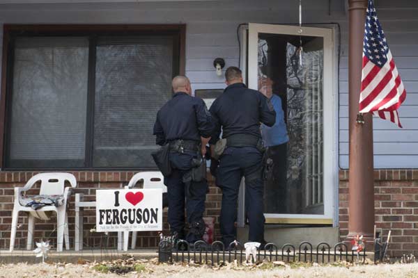 Police hunt for suspects after officers shot in Ferguson