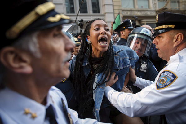 Marchers protest police violence in Baltimore, New York