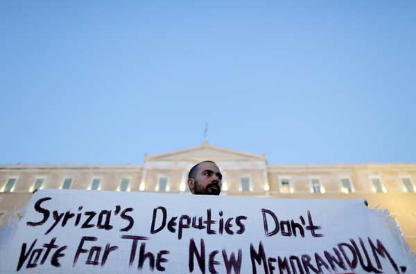 Greek faces tough conditions under deal with euro zone