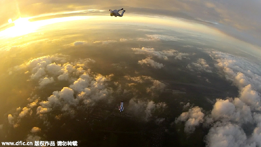 Skydivers soar through the edge of the world