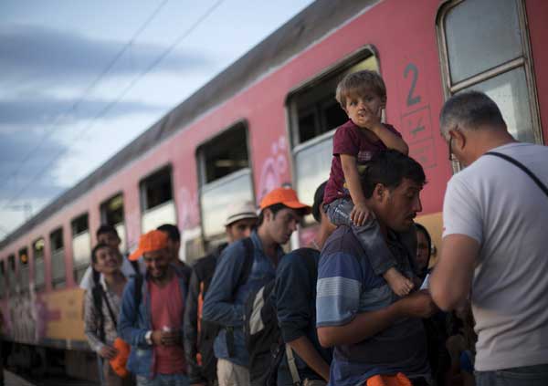 Germany frees up funds for refugees, speeds up asylum procedures