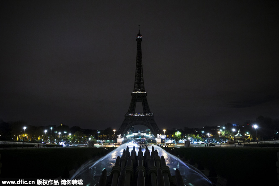Eiffel Tower goes dark as France mourns terrorist attack victims