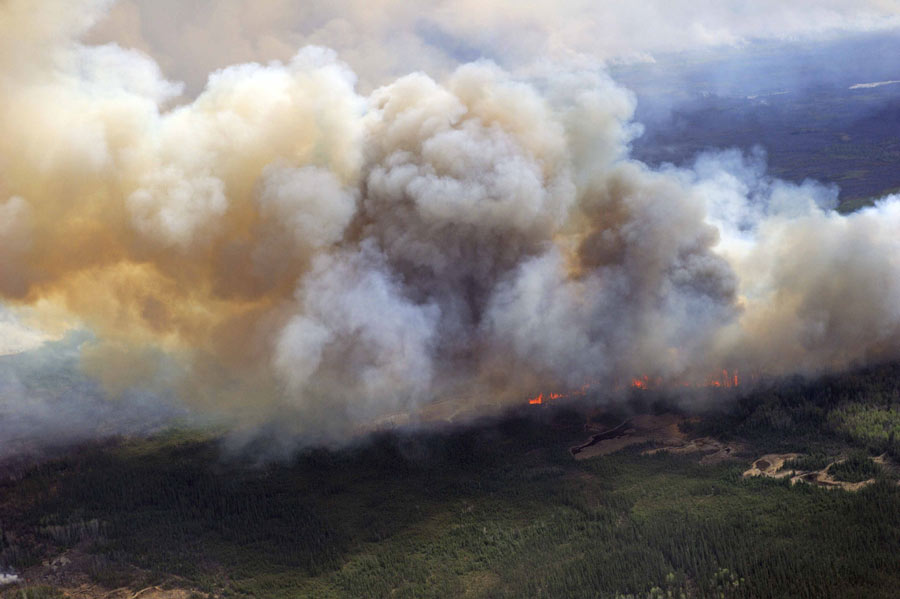 Raging wildfire spreads to more areas in west Canada