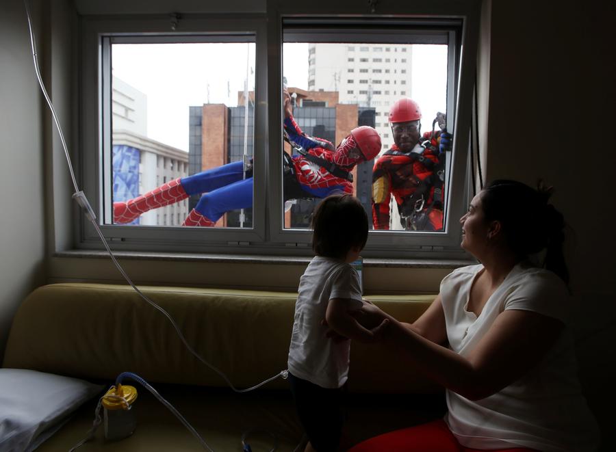 Superheroes cheer up sick children in Sao Paulo