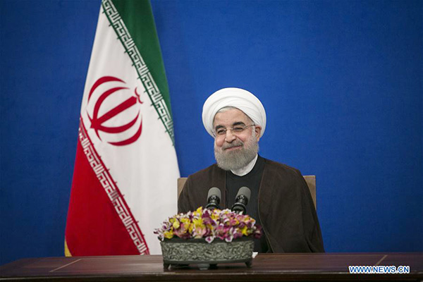 Re-elected Rouhani vows Iran's more interaction with world and 'no' to extremism