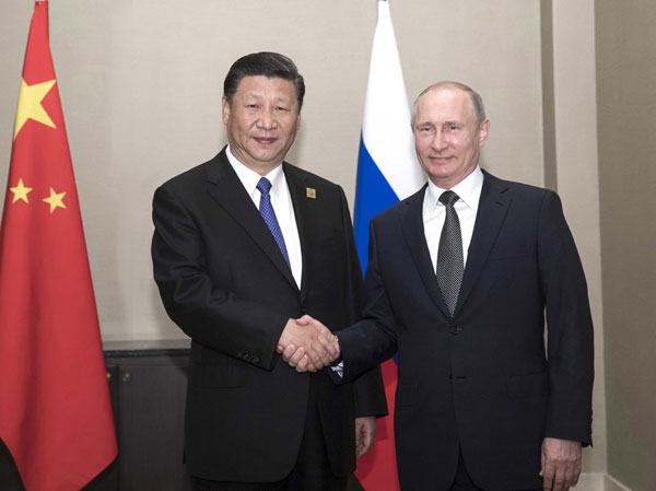 Xi: China, Russia should enhance ties, boost role of SCO