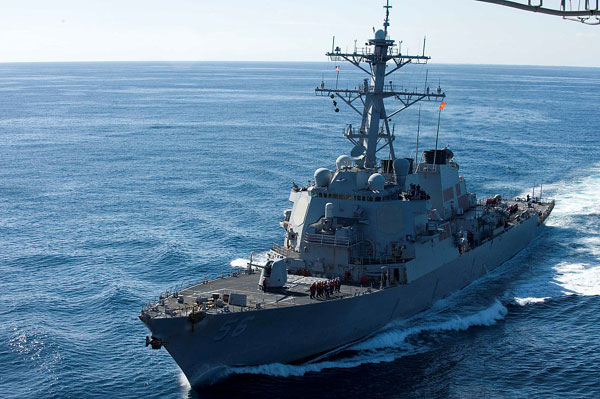 US destroyer in South China Sea violated law, harmed security