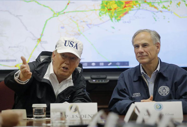 Trump surveys devastated Texas as Harvey rages on