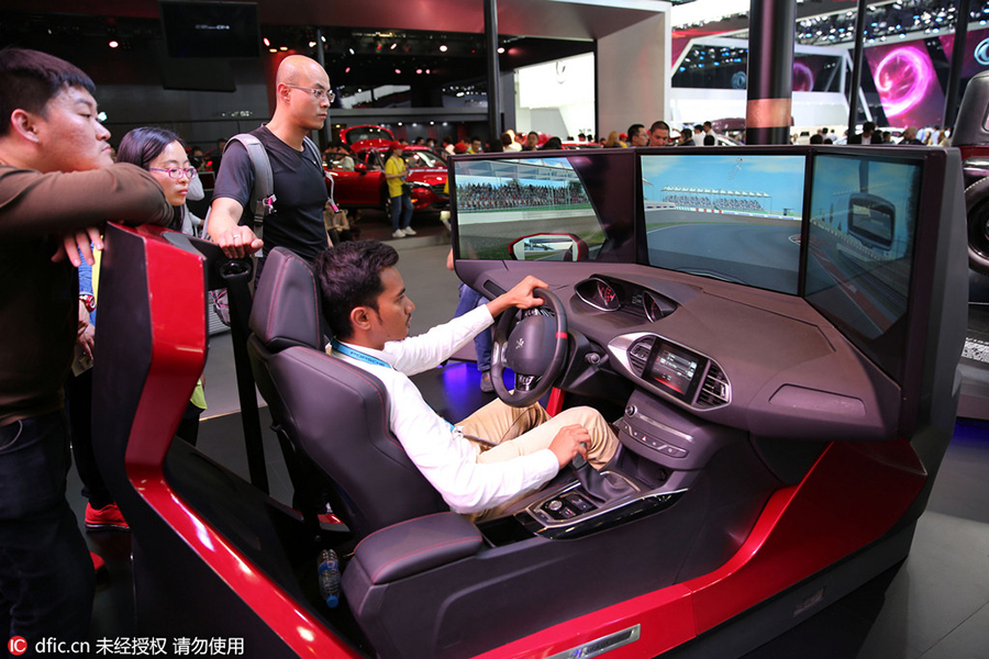 High–tech gadgets, not girls, main attraction at Beijing auto show
