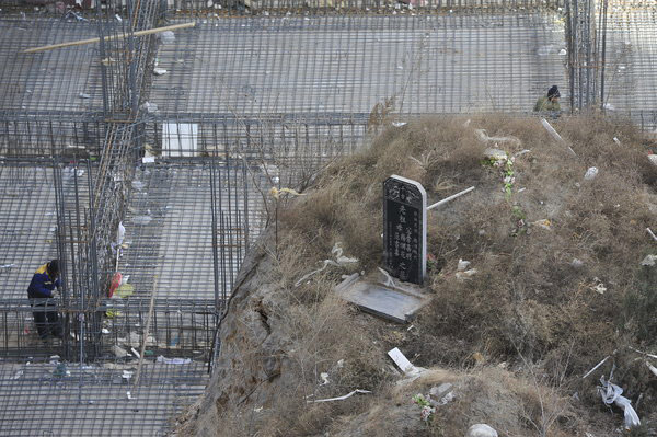 Mound of graves amid construction activity