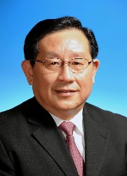 Minister re-elected non-communist party chairman